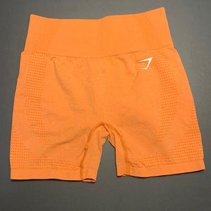 Orange Gymshark biker length shorts